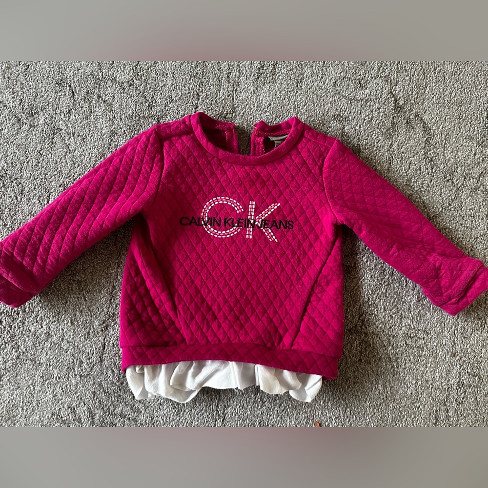 Calvin Klein Jeans. Hot pink sweater with white ruffles on the bottom. Size 3T